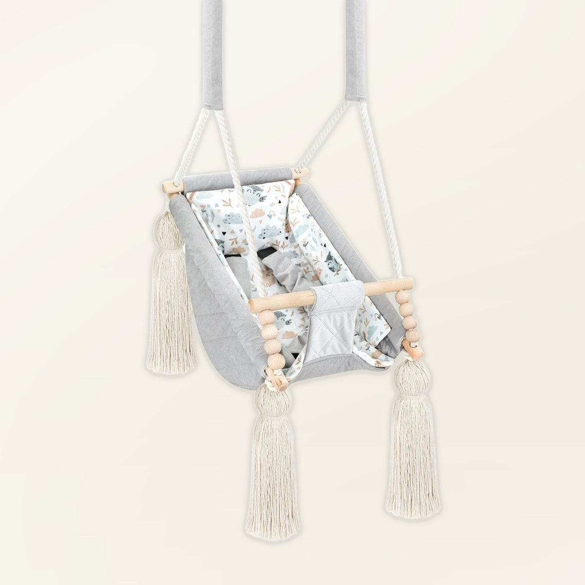 Baby Hammock Light Grey, in velvet, three-quarter view with tassels, wooden beads and padded seat