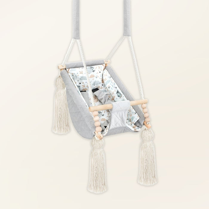 Baby Hammock Light Grey, in velvet, three-quarter view with tassels, wooden beads and padded seat