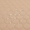 Baby twins swing - Waterproof and Secure Beige Double Seat, close-up of the waterproof quilted fabric with water droplets