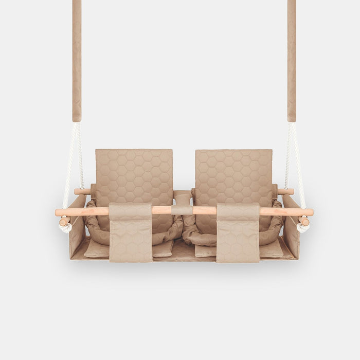 Baby twins swing - Waterproof and Secure Beige Double Seat, front view on a light background