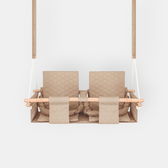 Baby twins swing - Waterproof and Secure Beige Double Seat, front view on a white background with two quilted seats