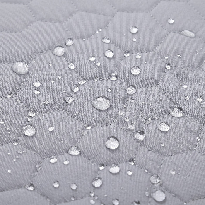 Baby twins swing - Waterproof and Secure Grey Double Seat, close-up of the waterproof quilted fabric with water droplets