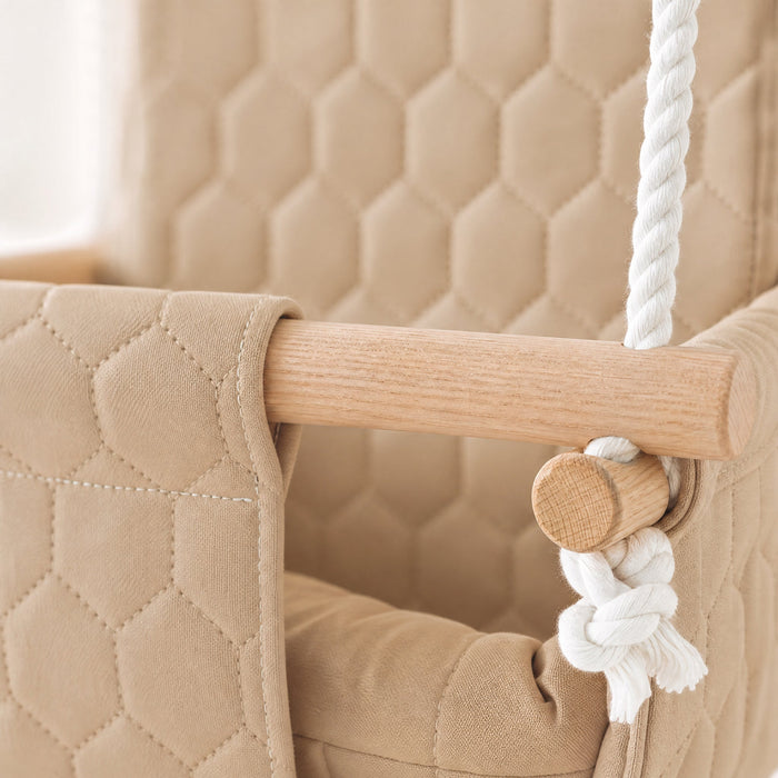 Waterproof secure baby swing Beige, close-up of the quilted fabric, beech wood bar and rope knot