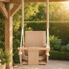 Waterproof secure baby swing Beige, in the garden near the hedge in the evening