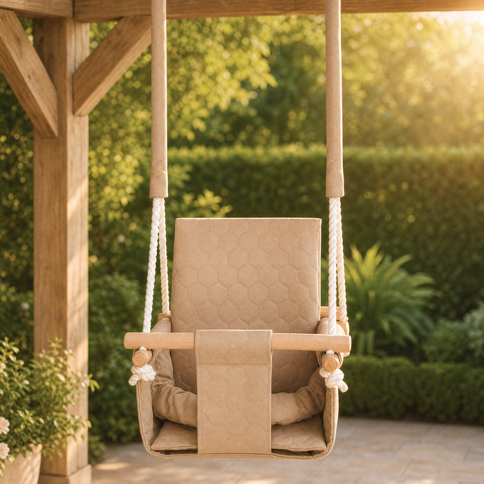 Waterproof secure baby swing Beige, in the garden near the hedge in the evening