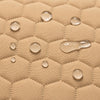 Waterproof secure baby swing Beige, water droplets on the quilted fabric
