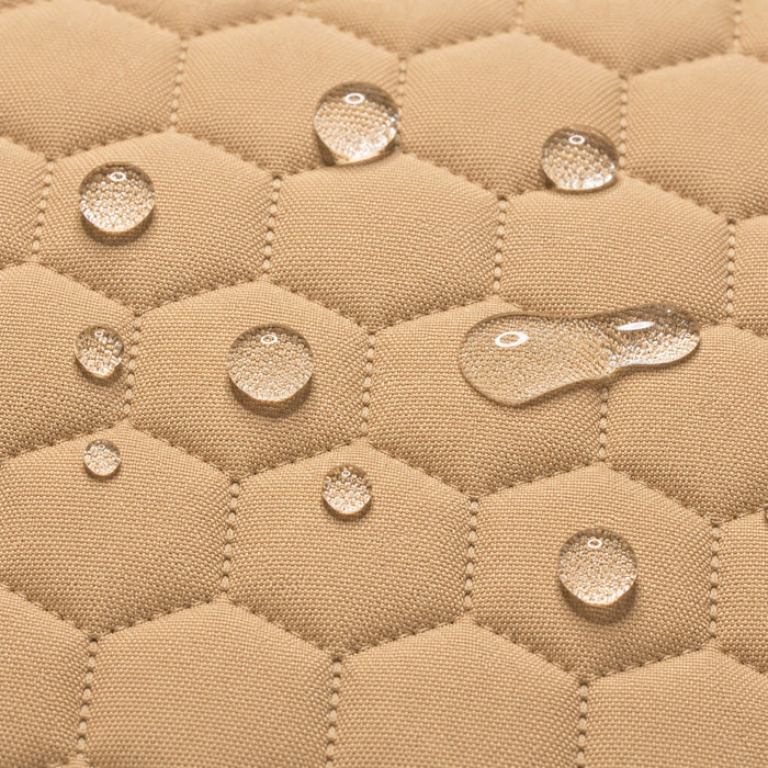 Waterproof secure baby swing Beige, water droplets on the quilted fabric