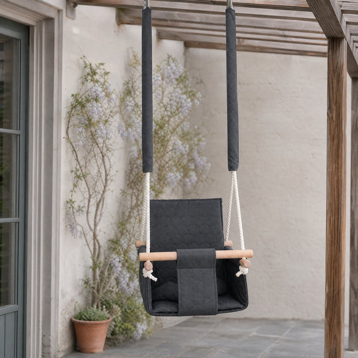 Waterproof secure baby swing Dark Grey, in the garden, under a pergola on the patio