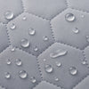 Waterproof secure baby swing Light Grey, water droplets on the quilted fabric