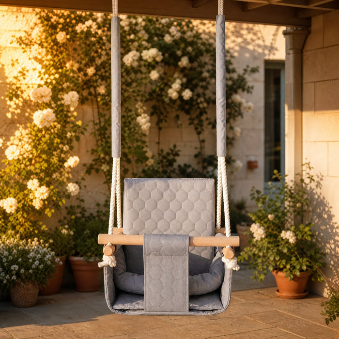 Waterproof secure baby swing Light Grey, in the garden, under a pergola on the patio